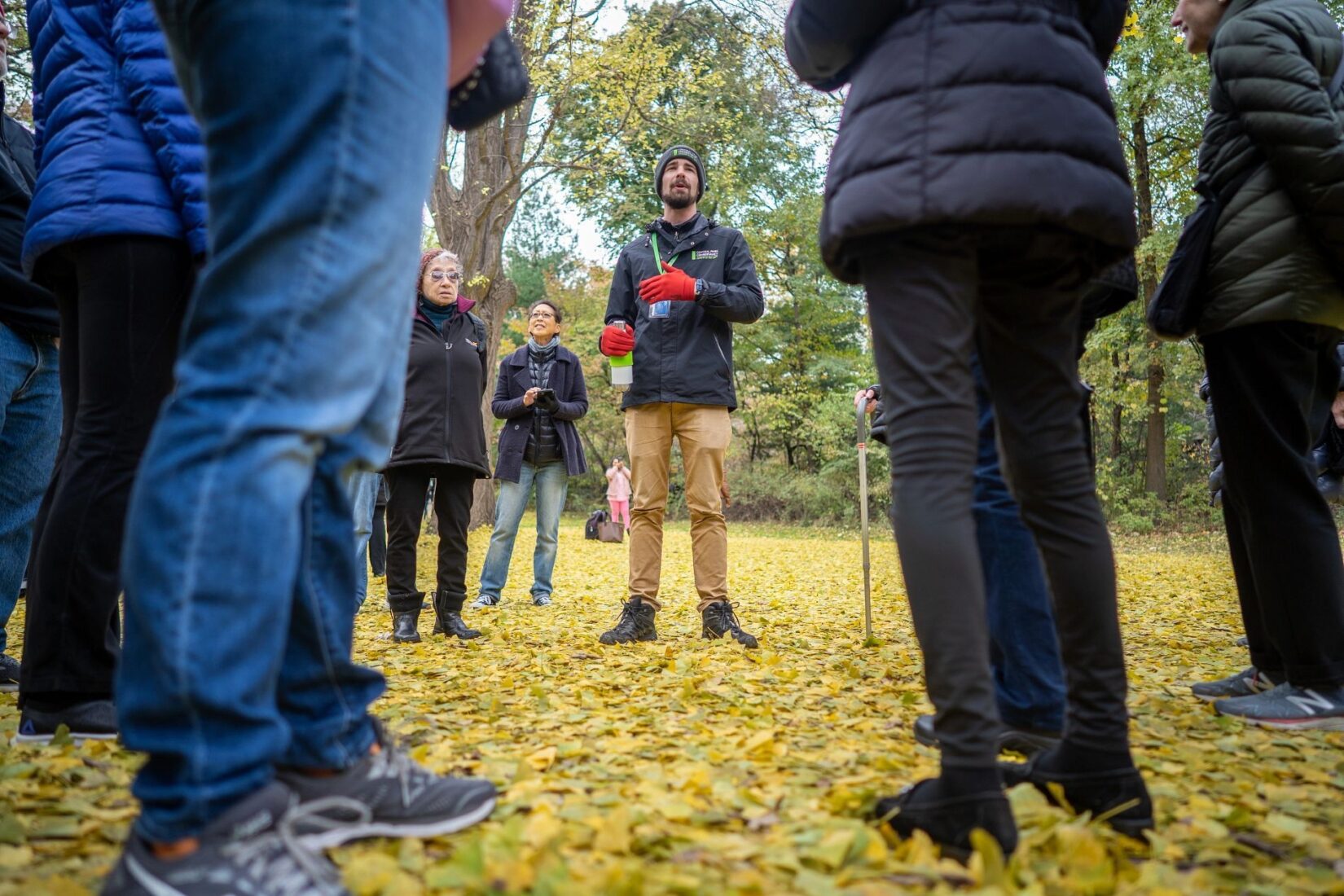 A Conservancy tour guide speaks to a circle of tour goers.